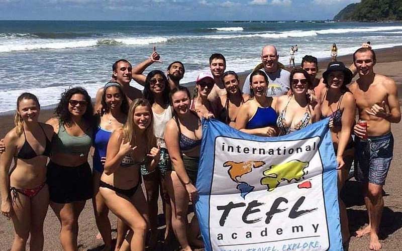 ITA graduates hanging out on the beach in Costa Rica