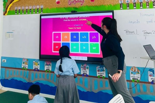 Sarah teaching young learners in a Thailand classroom