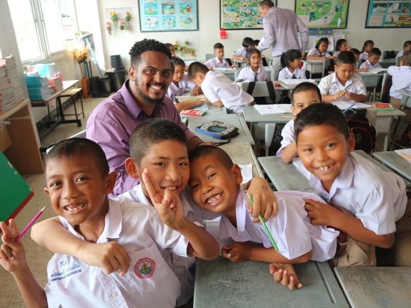 English teacher with young students in Thailand